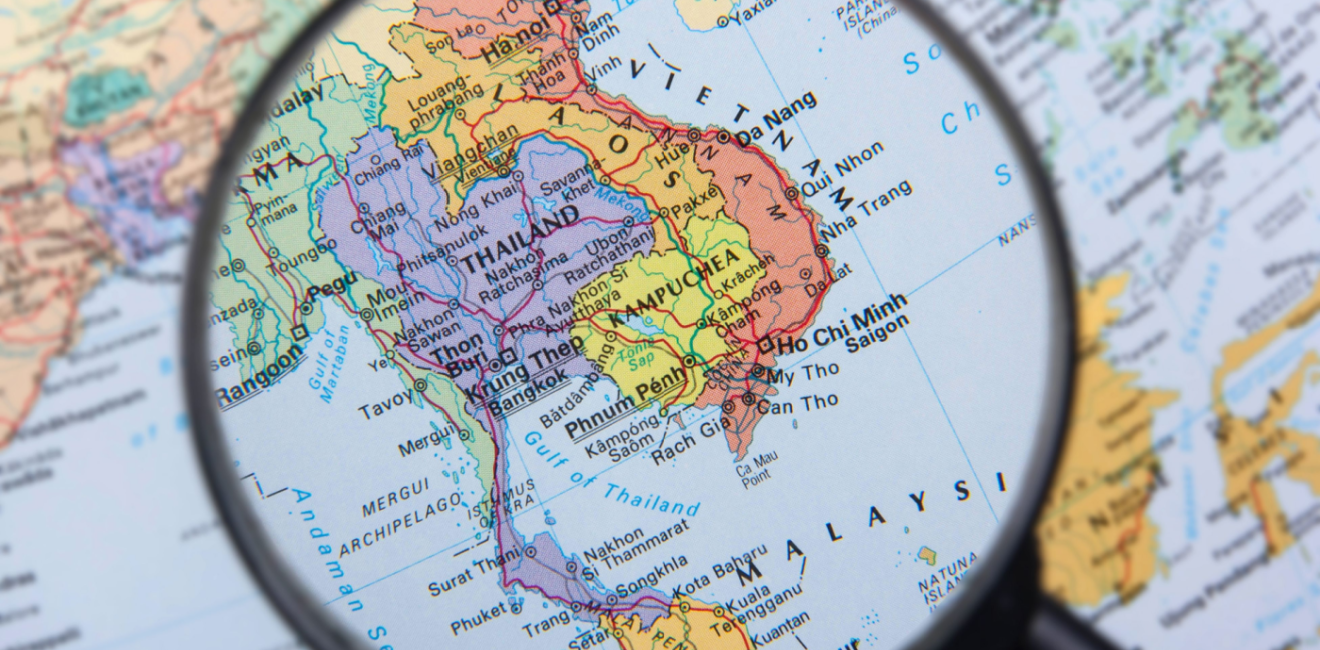 Magnifying glass over map of South East Asia