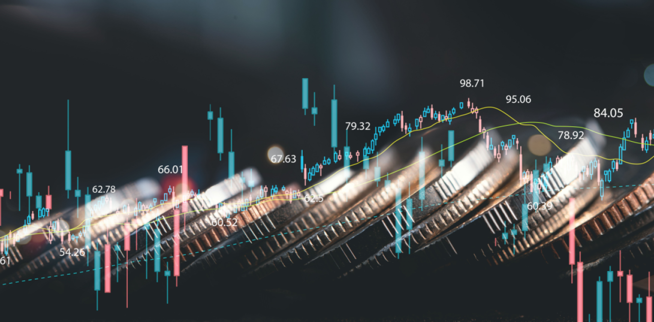 Financial chart trending upward with coins in the background