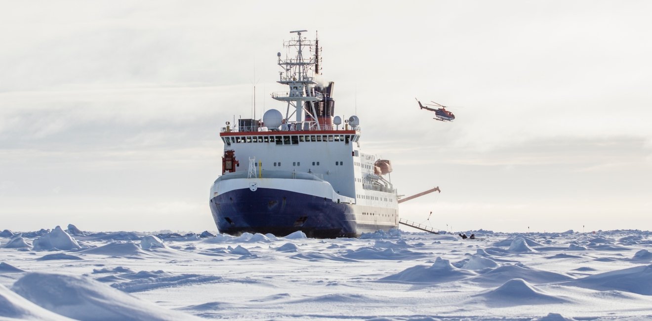 Photo of an icebreaker and helicopter