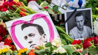 Pictures of Alexei Navalny are seen among flowers at his memorial in Berlin.