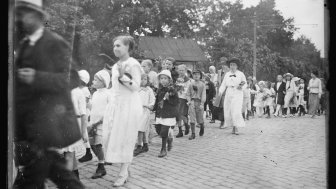 Children of Riga marching to the railway station of Riga