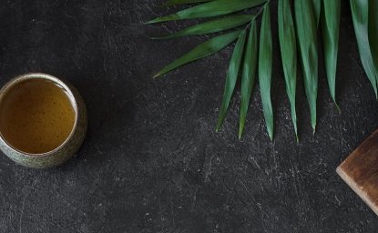 Image of tea pot against black background