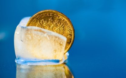 Ten Russian ruble coin in a piece of ice