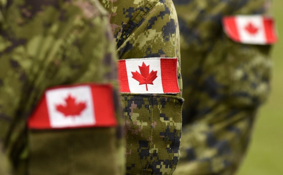 Canadian Soldiers with Flags on Arms