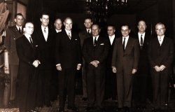 George F. Kennan, American diplomat and historian, posing with others.