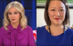 A news anchor speaks with Jean Lee.