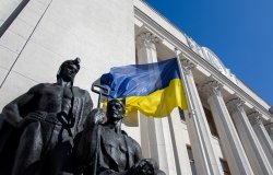 lag in front of the facade of the building of the Verkhovna Rada of Ukraine, June 2019