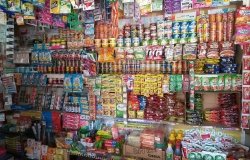 Image of convenience store wall covered in small plastic bags (sachets)