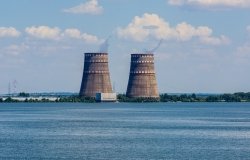 Image of nuclear power plant cooling towers across water