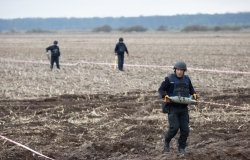 Ukrainian rescuers clear mines at the site of fighting between the Russian and Ukrainian armies in the Kyiv region, Ukraine