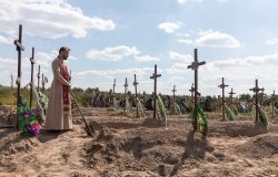 Burial of the remains of 13 unidentified and two identified people who were killed in the Bucha district during the Russian occupation